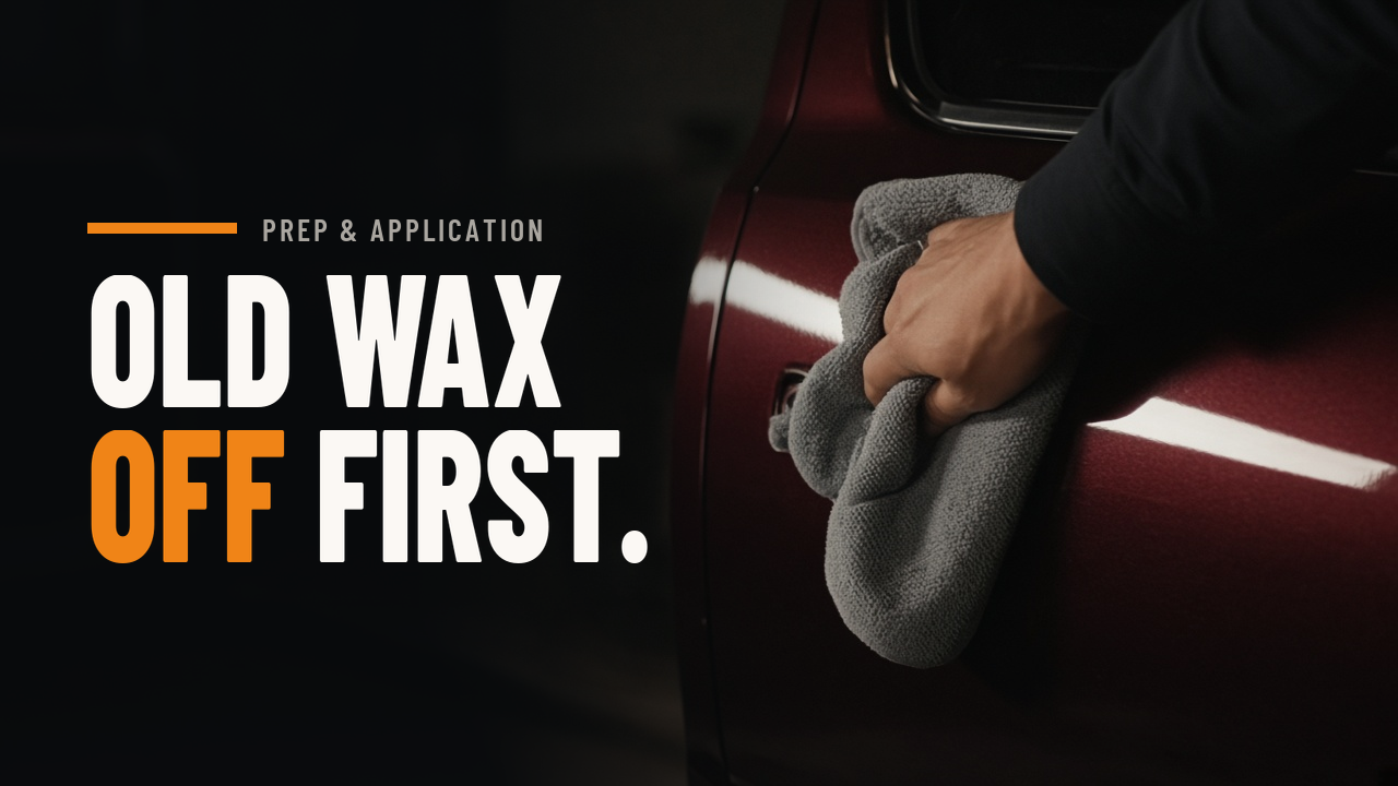 Hand wiping a car door with microfiber under raking garage light